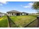 Spacious fenced backyard with lush green grass at 6235 Sw 95Th Pl, Ocala, FL 34476