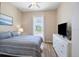 The bedroom features a queen bed, a window with natural lighting, and a dresser at 6235 Sw 95Th Pl, Ocala, FL 34476