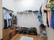 Walk-in closet with built-in shelving and hanging rods at 6235 Sw 95Th Pl, Ocala, FL 34476