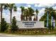 Community sign for Cherrywood Preserve, a 55+ active adult community, surrounded by palm trees at 6235 Sw 95Th Pl, Ocala, FL 34476