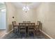 Elegant dining room with stylish chairs, a chandelier, and neutral decor at 6235 Sw 95Th Pl, Ocala, FL 34476
