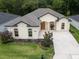 Inviting home exterior with a well-manicured lawn and beautiful landscaping at 6235 Sw 95Th Pl, Ocala, FL 34476