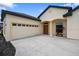 Inviting home featuring an attached garage, stucco exterior, and meticulously kept landscaping at 6235 Sw 95Th Pl, Ocala, FL 34476