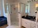 Bathroom featuring a glass-enclosed shower, dark countertop vanity and tile flooring at 6925 Nw Highway 225A, Ocala, FL 34482