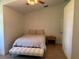 Inviting bedroom featuring hardwood floors, vaulted ceilings, plush bedding, a comfortable bench, and soft natural light at 6925 Nw Highway 225A, Ocala, FL 34482