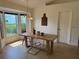 Bright dining room with natural light, modern table, minimalist decor, and hardwood floors, ideal for gatherings at 6925 Nw Highway 225A, Ocala, FL 34482