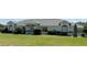 Charming single-story home featuring a well-manicured lawn and beautiful landscaping at 6925 Nw Highway 225A, Ocala, FL 34482