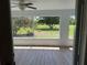 Screened-in porch offering serene views of the backyard and mature landscaping at 6925 Nw Highway 225A, Ocala, FL 34482