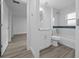 Well-lit bathroom featuring modern vanity and stylish tiled shower, offering a blend of comfort and style at 7 Walnut Pl, Ocala, FL 34480