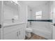 Modern bathroom featuring sleek vanity, toilet, and tiled shower/bath, creating a serene and functional space at 7 Walnut Pl, Ocala, FL 34480