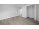 Well-lit bedroom featuring modern flooring, white walls, and closet space for a comfortable retreat at 7 Walnut Pl, Ocala, FL 34480