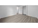 Light and airy bedroom featuring closet space and modern flooring, creating a comfortable living space at 7 Walnut Pl, Ocala, FL 34480