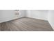 Bright bedroom with a large window and modern flooring, providing a cozy and inviting atmosphere at 7 Walnut Pl, Ocala, FL 34480