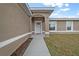 Inviting front entrance featuring a covered porch and manicured landscaping at 7 Walnut Pl, Ocala, FL 34480