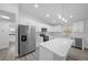 Bright kitchen featuring stainless steel appliances, quartz counters, and ample storage at 7 Walnut Pl, Ocala, FL 34480