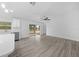 Open concept living area with kitchen view featuring stainless appliances and quartz countertops at 7 Walnut Pl, Ocala, FL 34480