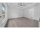 A spacious main bedroom includes recessed lighting, a ceiling fan, tray ceiling, and neutral walls and floors at 7 Walnut Pl, Ocala, FL 34480