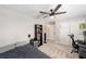 Neutral bedroom featuring a ceiling fan, and double door closet at 7442 Sw 129Th Ln, Ocala, FL 34473