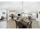 Open concept dining area with a view of the living area and kitchen at 7442 Sw 129Th Ln, Ocala, FL 34473
