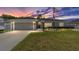 Charming one-story home with a well-manicured lawn and an American flag at 7442 Sw 129Th Ln, Ocala, FL 34473
