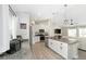 Open concept kitchen with stainless steel appliances, granite counters, a central island, and a view into the living room at 7442 Sw 129Th Ln, Ocala, FL 34473