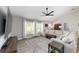 Comfortable living room with large windows, vaulted ceiling and modern decor at 7442 Sw 129Th Ln, Ocala, FL 34473