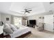 Bright main bedroom with neutral walls, ceiling fan, and a large window at 7442 Sw 129Th Ln, Ocala, FL 34473