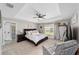 Spacious main bedroom with tray ceiling, plush carpeting, and a view of the backyard at 7442 Sw 129Th Ln, Ocala, FL 34473