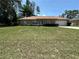 Charming single-story home with a spacious front yard and a two-car garage at 7800 Sw 127Th Loop, Ocala, FL 34473