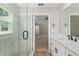 Modern bathroom featuring walk-in glass shower and vanity at 8293 Se 158Th St, Summerfield, FL 34491