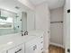 Bright bathroom featuring a white vanity, quartz countertop, black fixtures, and a glass-enclosed shower at 8293 Se 158Th St, Summerfield, FL 34491
