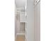 Walk-in closet with custom white shelving for optimized storage solutions and organization at 8293 Se 158Th St, Summerfield, FL 34491