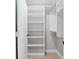 Neat closet interior with white shelves and carpet flooring at 8293 Se 158Th St, Summerfield, FL 34491