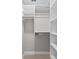 Walk-in closet with custom built-in shelving offering ample storage solutions at 8293 Se 158Th St, Summerfield, FL 34491