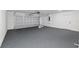 Spacious two-car garage with epoxy floor and a clean, organized appearance at 8293 Se 158Th St, Summerfield, FL 34491