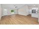 Open living space with a view of the entryway and modern kitchen at 8293 Se 158Th St, Summerfield, FL 34491