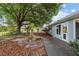Charming backyard featuring a deck, mature tree and water feature at 9001 Sw 91St Cir, Ocala, FL 34481