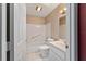 Bright bathroom with tiled floors, tub and shower combo, and single sink vanity at 9001 Sw 91St Cir, Ocala, FL 34481