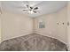 Neutral bedroom featuring a ceiling fan, carpeted floor and window at 9001 Sw 91St Cir, Ocala, FL 34481