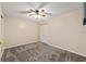 Neutral bedroom featuring a ceiling fan, closet, and plush carpeting at 9001 Sw 91St Cir, Ocala, FL 34481