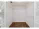 Walk-in closet featuring built-in shelving for efficient storage and organization at 9001 Sw 91St Cir, Ocala, FL 34481