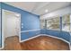 Dining area with bay window and adjacent access to the laundry room at 9001 Sw 91St Cir, Ocala, FL 34481