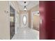 Bright foyer features tile flooring and views into the living spaces at 9001 Sw 91St Cir, Ocala, FL 34481