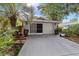 Welcoming facade with a two-car garage and beautiful landscaping at 9001 Sw 91St Cir, Ocala, FL 34481