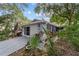 Lovely home with lush tropical landscaping and a screened garage at 9001 Sw 91St Cir, Ocala, FL 34481