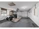 Spacious garage featuring an electric golf cart at 9001 Sw 91St Cir, Ocala, FL 34481