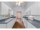 Functional kitchen featuring white cabinetry, modern appliances, and hardwood floors at 9001 Sw 91St Cir, Ocala, FL 34481