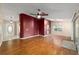 Open-concept living space with wood flooring and ample natural light at 9001 Sw 91St Cir, Ocala, FL 34481