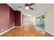Open living area with wood floors and sliding door access to patio at 9001 Sw 91St Cir, Ocala, FL 34481