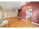 Large living room with wood floors and access to kitchen and patio at 9001 Sw 91St Cir, Ocala, FL 34481